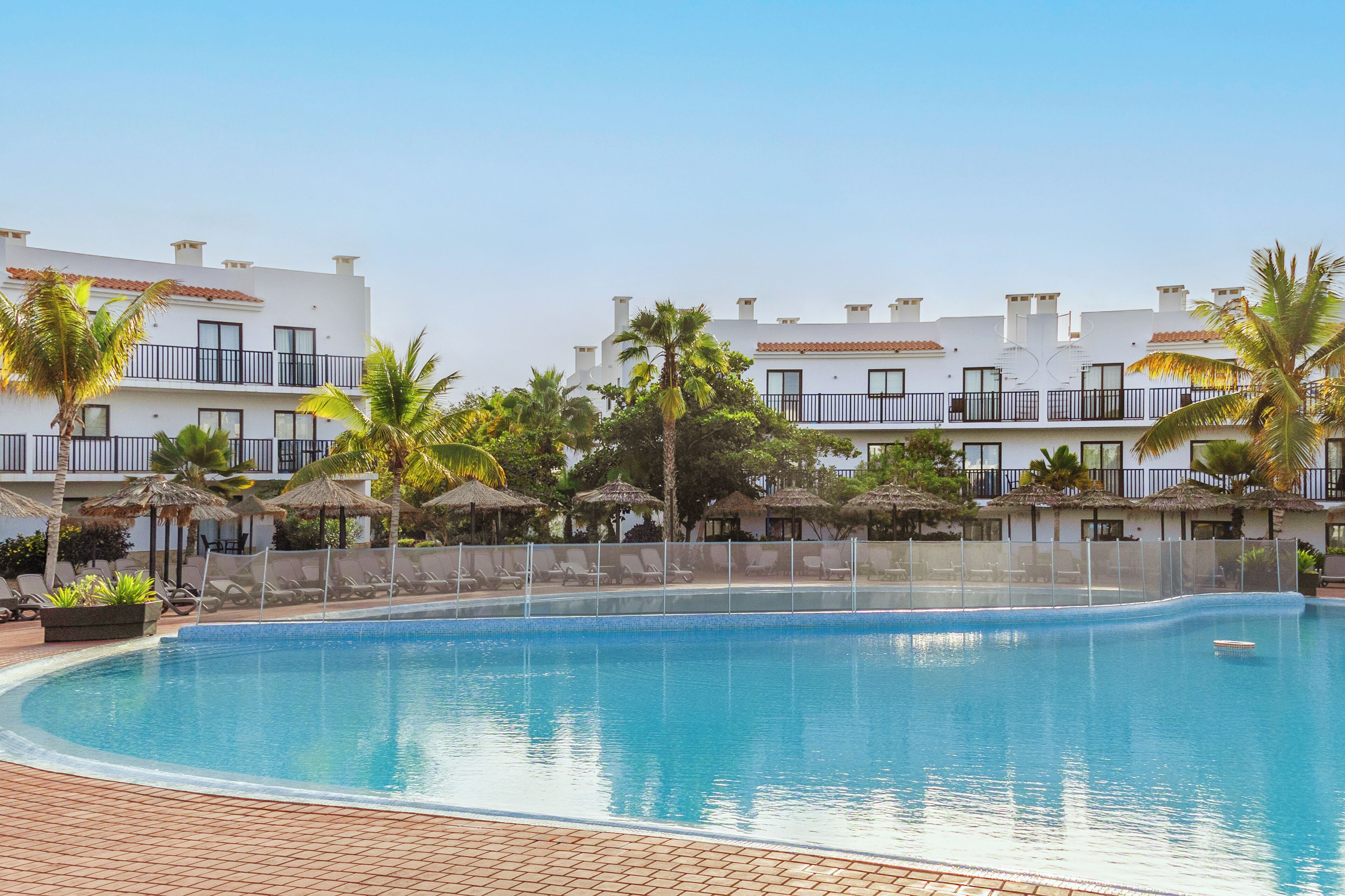 Outdoor pool, pool umbrellas, sun loungers