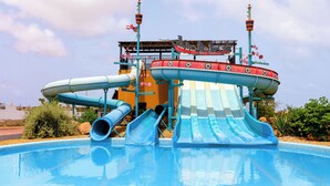 A water park with multiple slides and a pool. - Sol Dunas Family Fun (Sal)