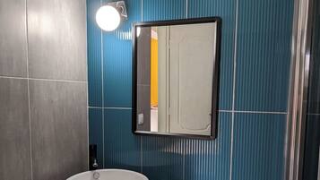 Superior Studio Suite, 1 Queen Bed, Patio, Ocean View | Bathroom | Shower, rainfall showerhead, hair dryer, slippers
