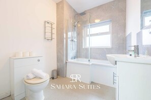 Shower, hair dryer, towels