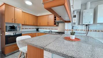 Casa família, vista para a cidade | Cozinha privada