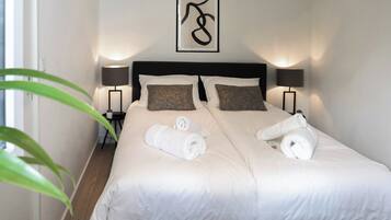 1 bedroom, desk, iron/ironing board, travel crib