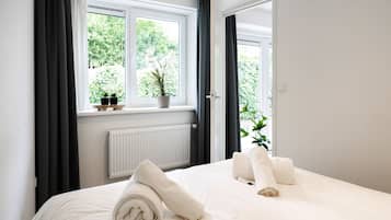 1 bedroom, desk, iron/ironing board, travel crib