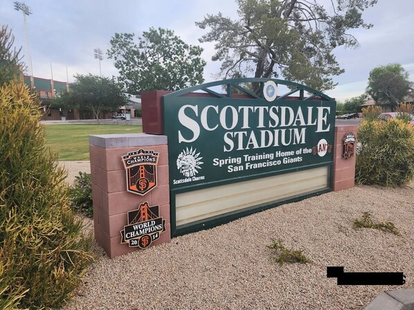 A sign for Scottsdale Stadium with logos for the San Francisco Giants and the 2014 World Series Champions.