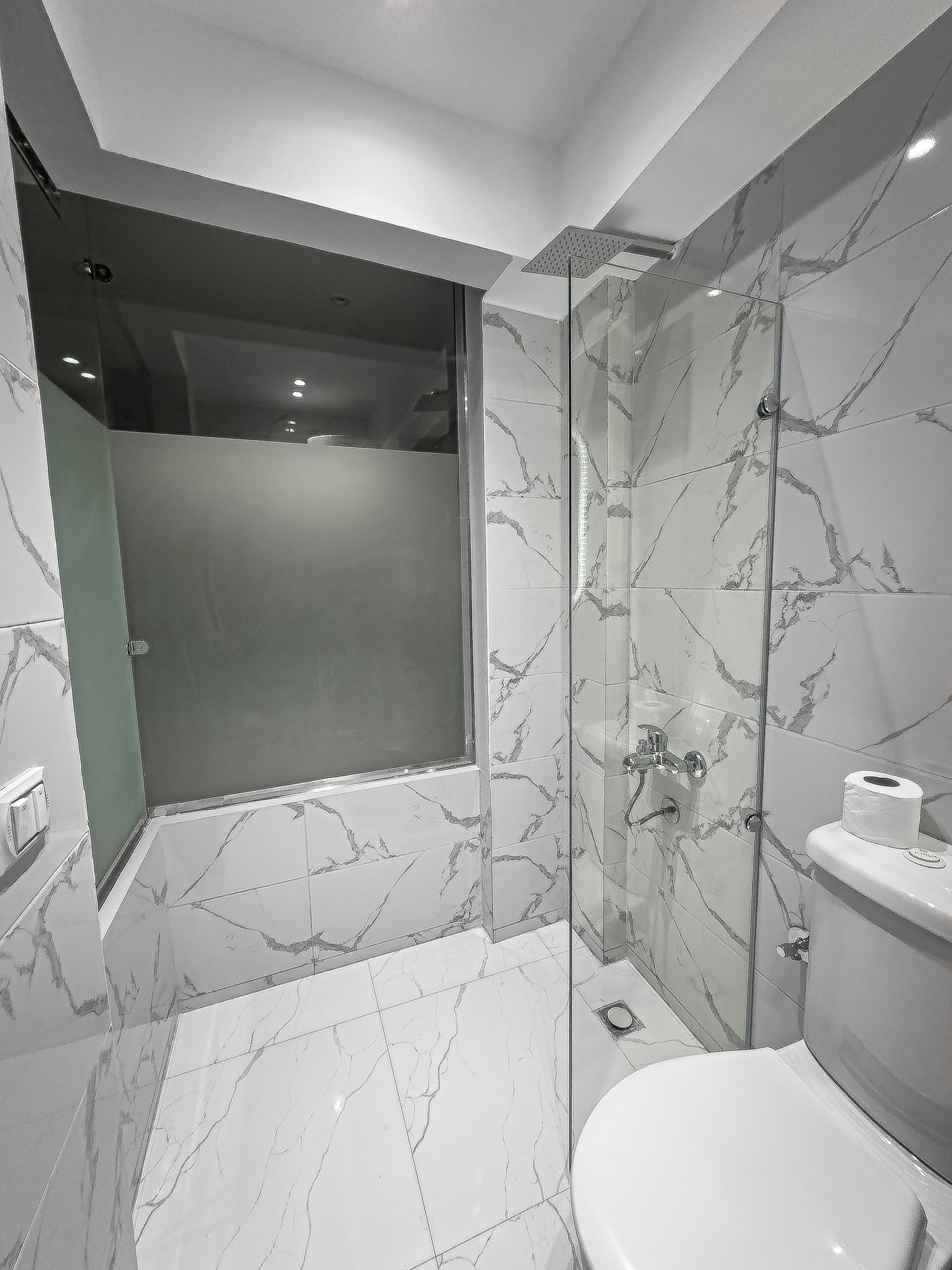 Shower, hair dryer, slippers, towels