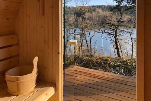 Ferienhaus 219 mit Seeblick, privater Terrasse und WLAN