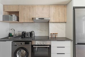 Fridge, microwave, oven, stovetop - The York | Light + Spacious Apartment (Cape Town)