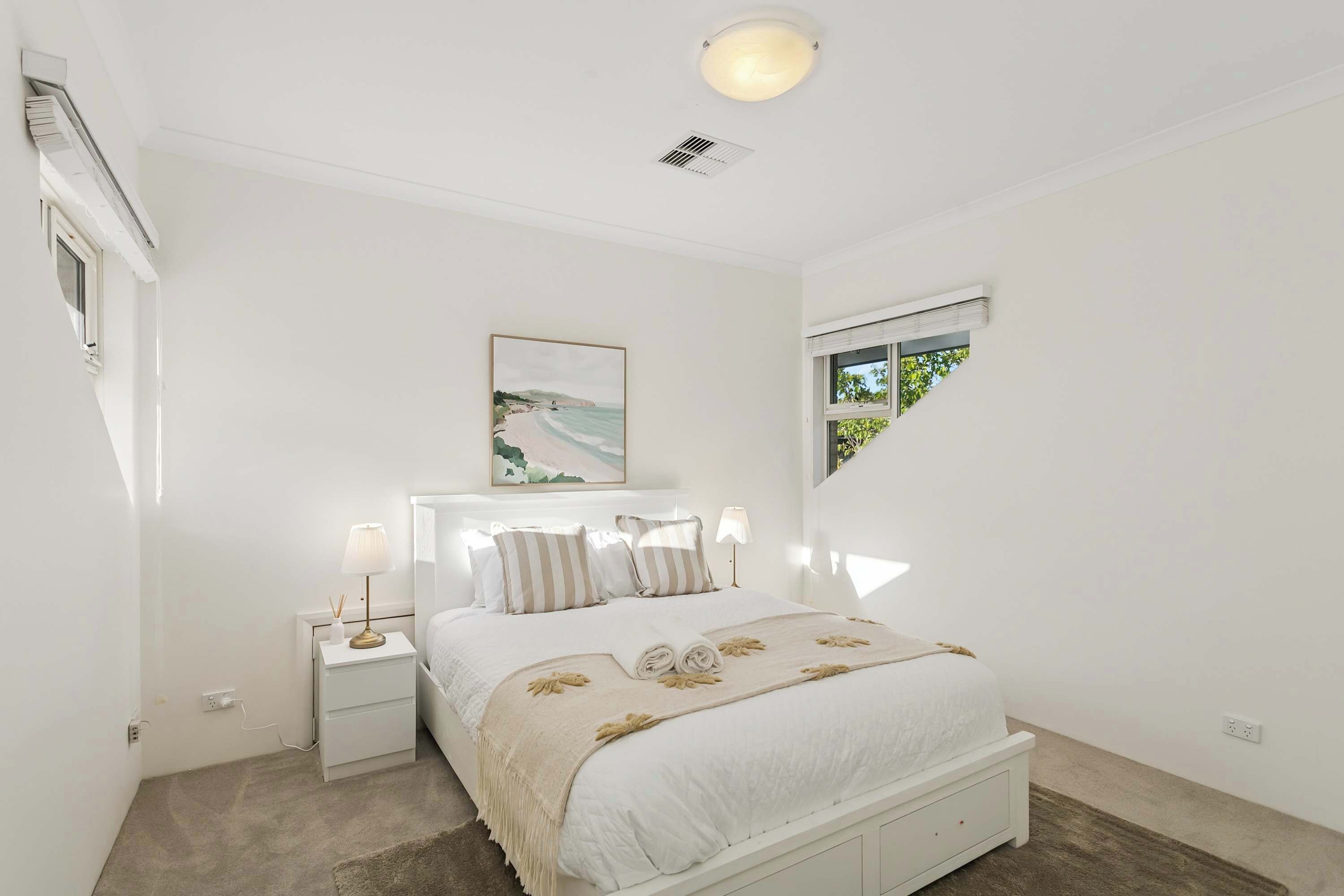 Neatly designed bedroom with a calm, inviting atmosphere.