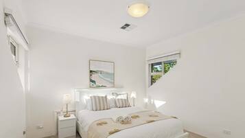 Neatly designed bedroom with a calm, inviting atmosphere.