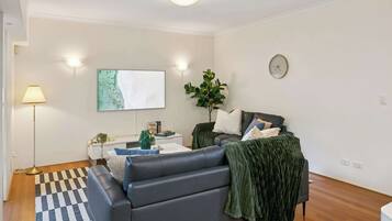 Living room designed with neutral tones and a clean, minimalist look.