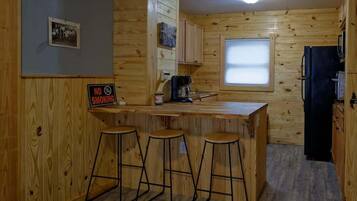 Fridge, microwave, coffee/tea maker, cookware/dishes/utensils