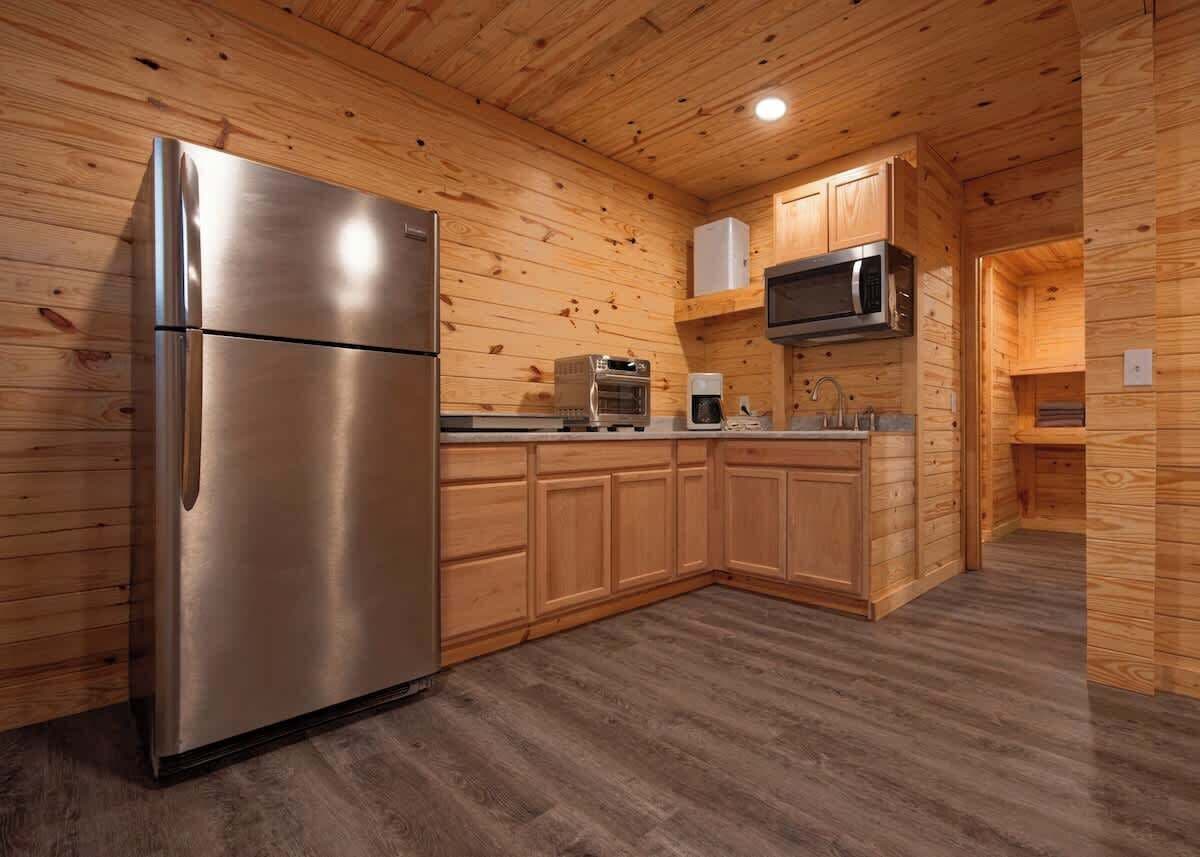 Fridge, microwave, coffee/tea maker, cookware/dishes/utensils