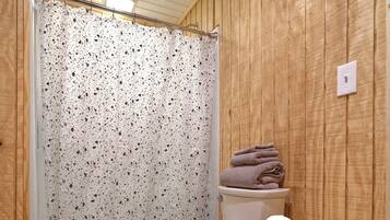 Shower, hair dryer, towels, shampoo