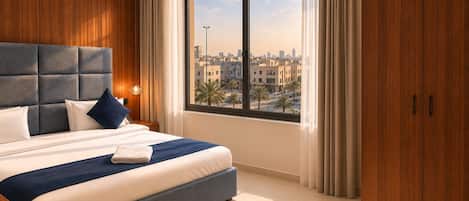 Suite Deluxe, vista a la ciudad | Tabla de planchar con plancha y wifi gratis