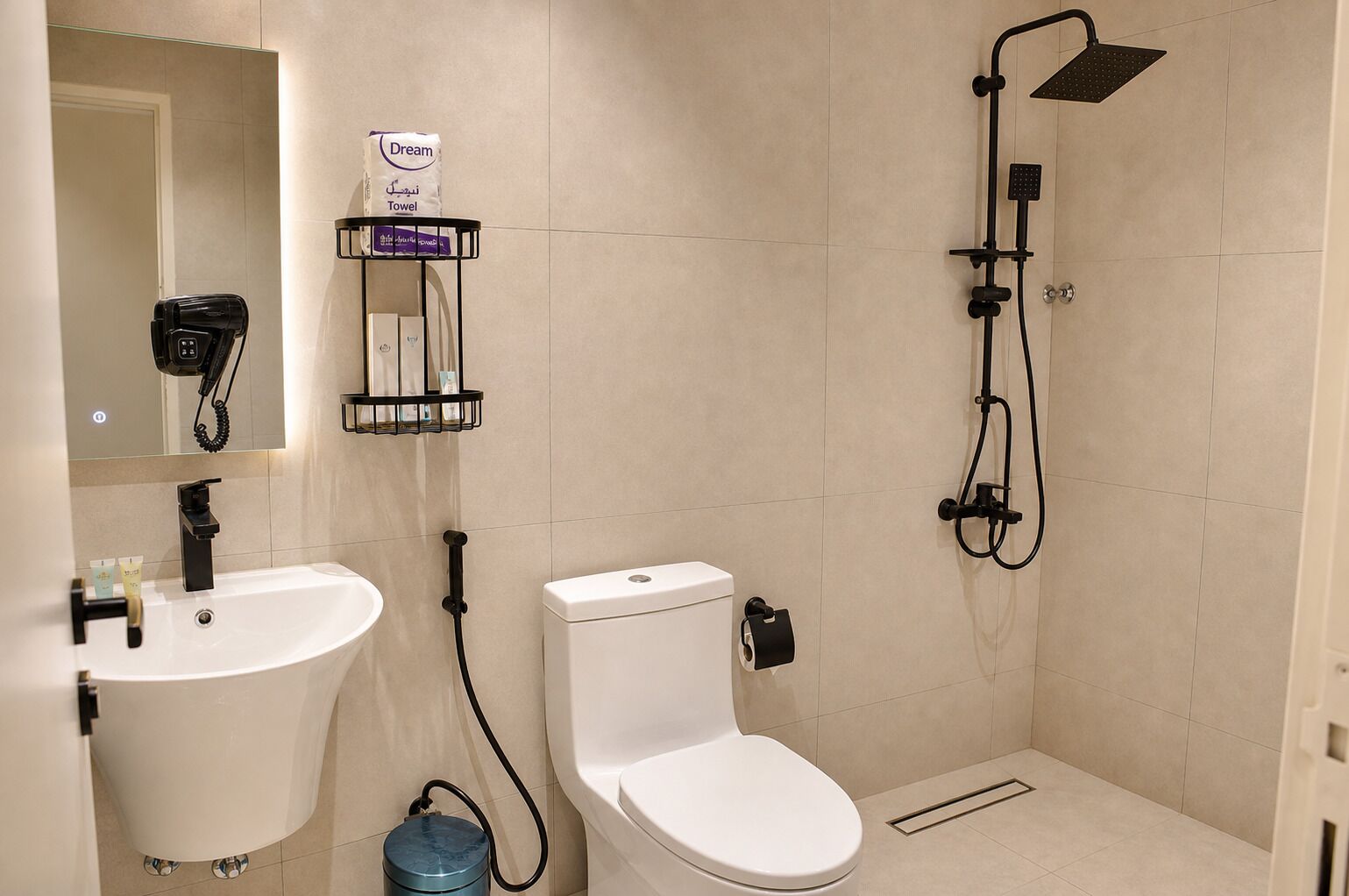 A bathroom with a sink, toilet, and shower.