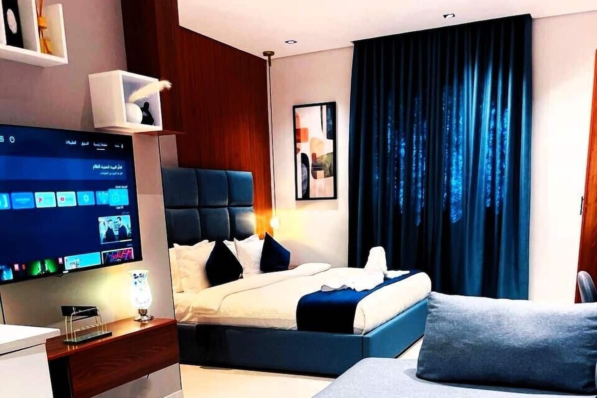 Suite Deluxe, vista città | Ferro/asse da stiro, Wi-Fi gratuito