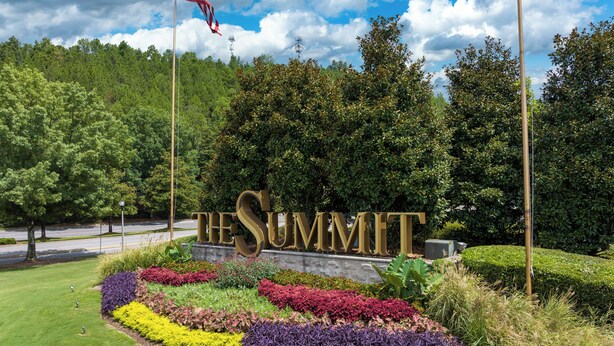 A landscaped area with a sign reading "THE SUMMIT." - Spacious 3BR Condo w/ Private Off-Street Parking for 3 Vehicles! (Vestavia Hills)