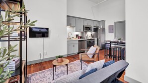 A modern apartment with a living room, kitchen, and dining area. - Near Hospitals & DT ~ Bright+Parking+W/D+Churchill (Louisville)