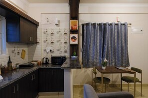 Fridge, microwave, electric kettle, cookware/dishes/utensils