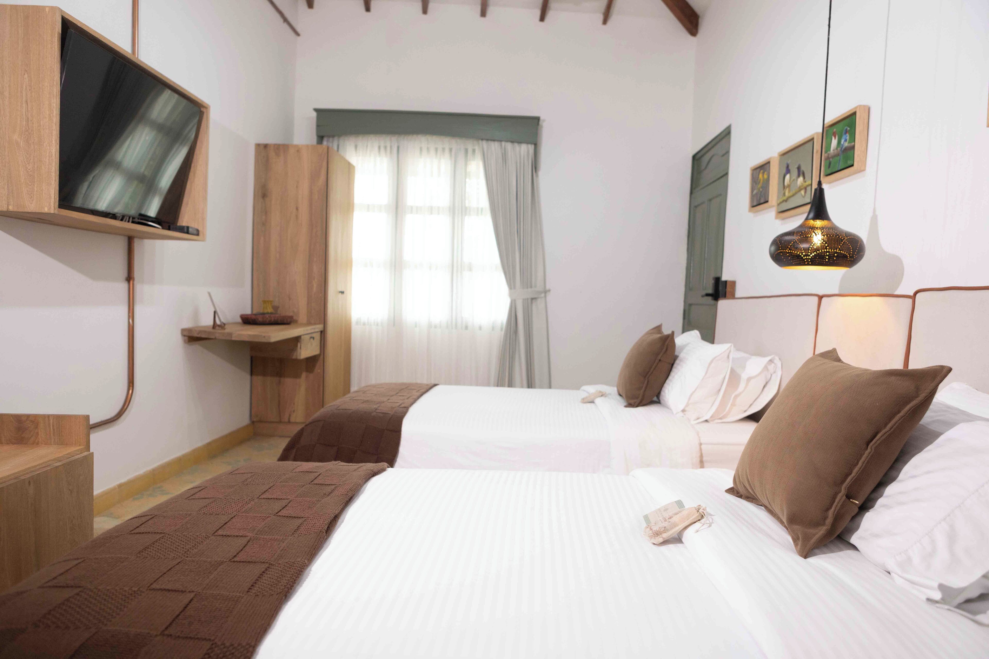 Kahden hengen luksushuone, patio | Minibaari, tallelokero huoneessa, ilmainen Wi-Fi, vuodevaatteet