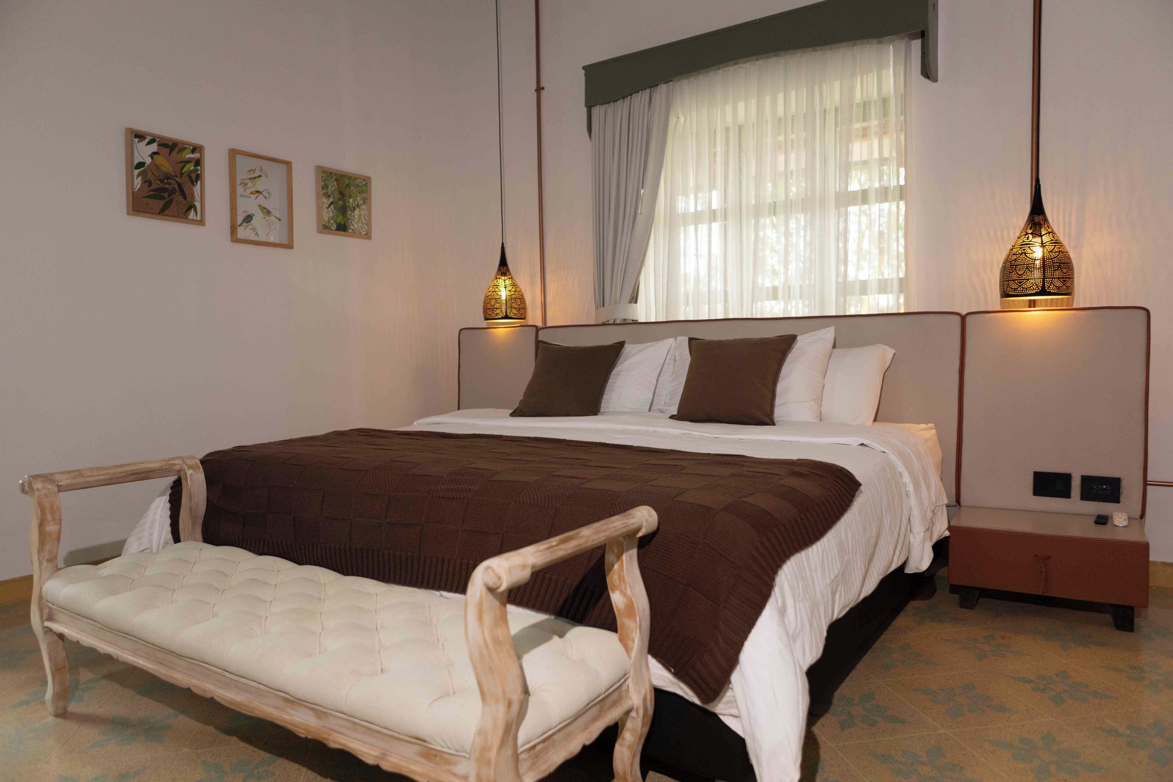 Luksussviitti, patio, näköala puutarhaan | Minibaari, tallelokero huoneessa, ilmainen Wi-Fi, vuodevaatteet