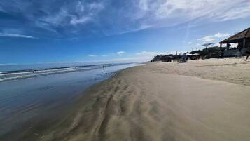On the beach, white sand, 2 beach bars