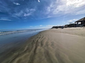 On the beach, white sand, 2 beach bars