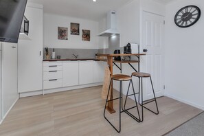 Fridge, microwave, toaster, cookware/dishes/utensils