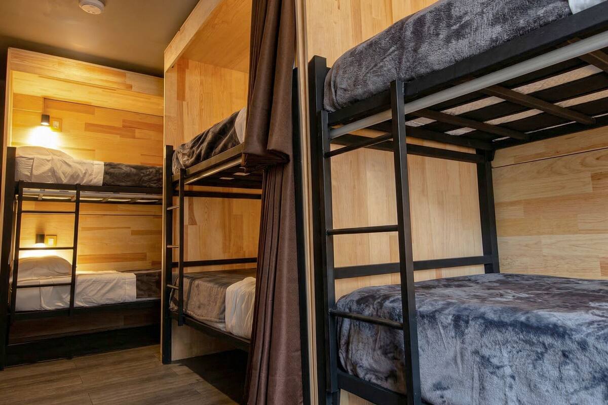 Premium bedding, blackout curtains, iron/ironing board (on request)