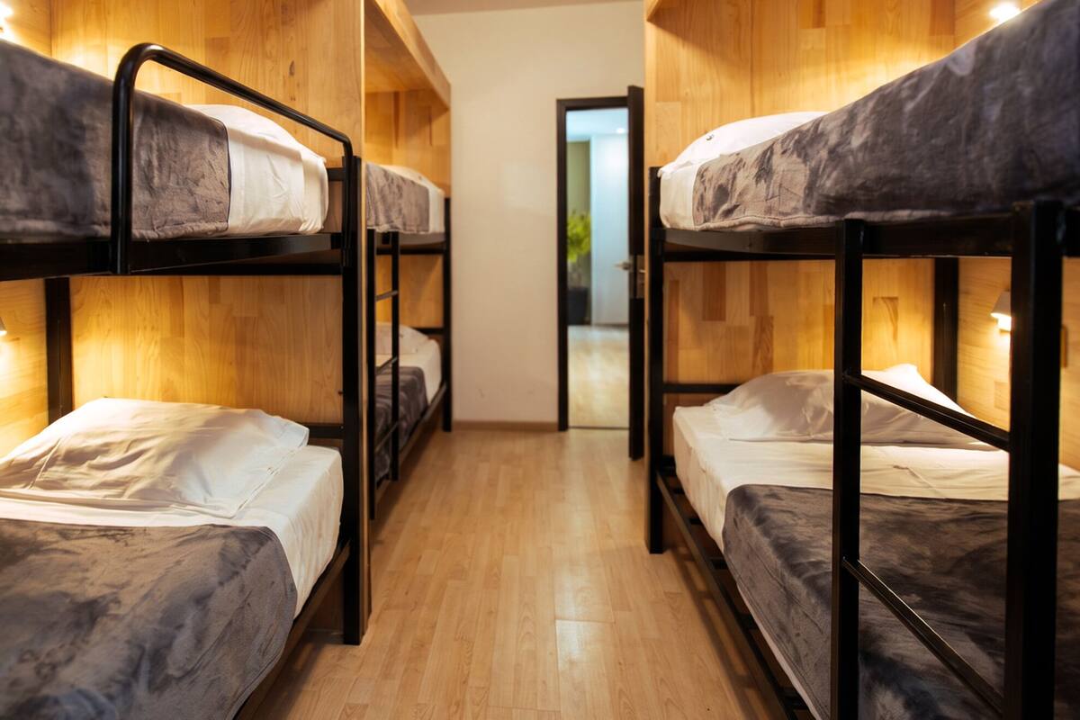 Premium bedding, blackout curtains, iron/ironing board (on request)
