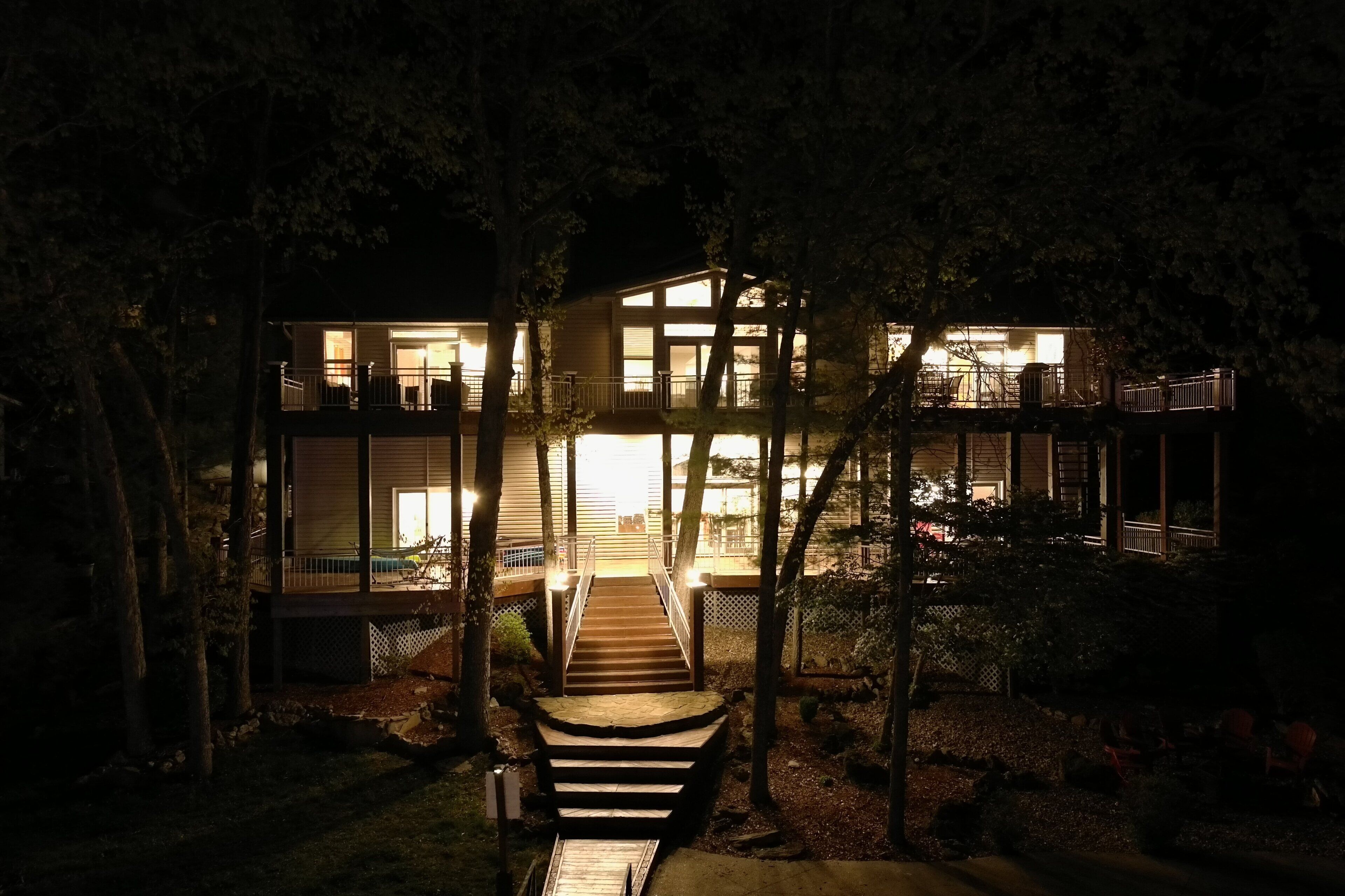 A two-story building with a central staircase leading to a balcony.