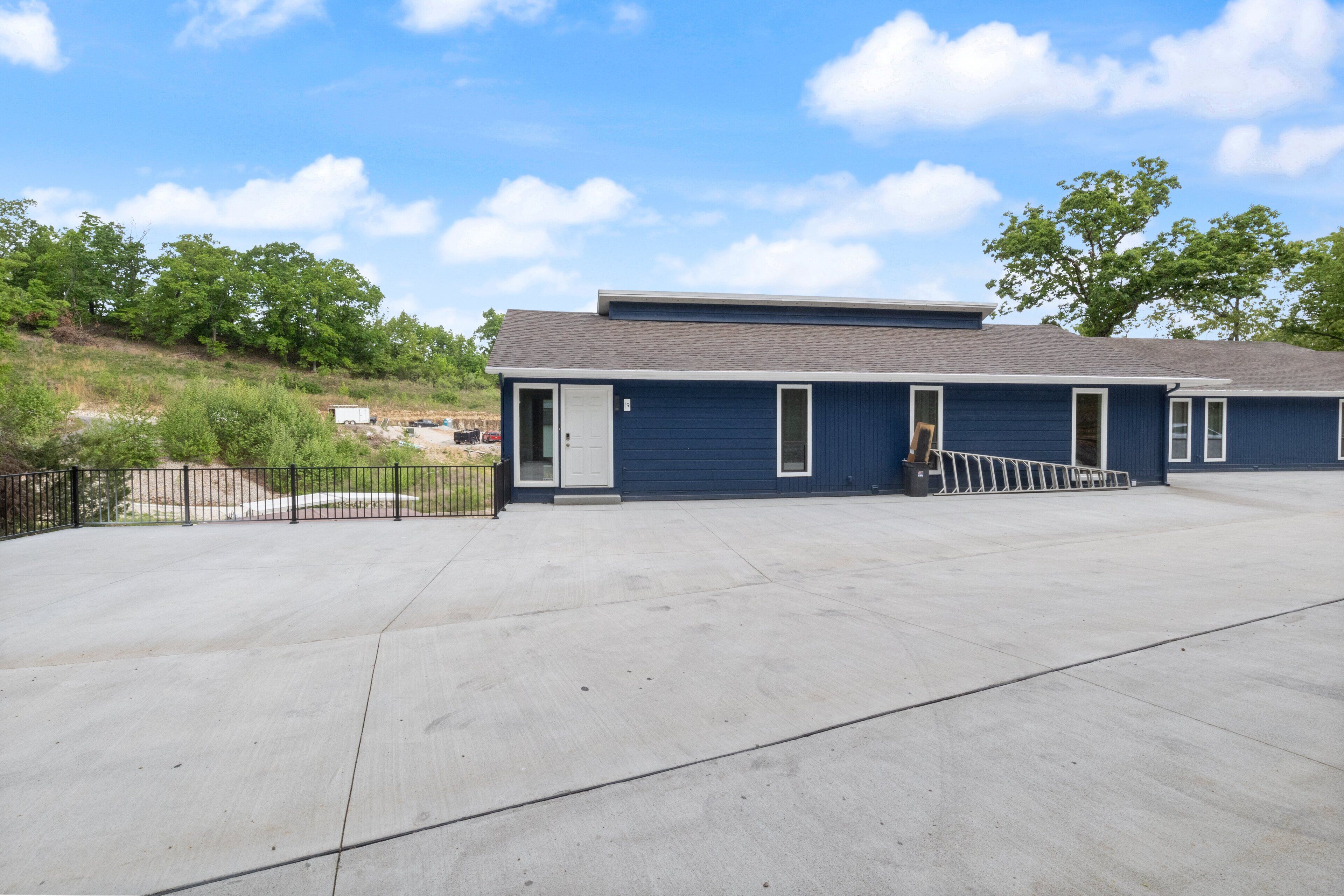 A building with a flat roof and a covered outdoor area.