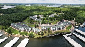 A resort with multiple buildings, a dock area, and a lake. - Penthouse Living In The Heart of the State Park (Kaiser)