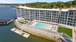 A modern hotel with a large pool, waterfront view, and a dock. - Scenic Views, Outdoor Grill & Dine, Fireplace, Games (Osage Beach)