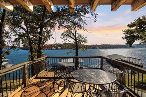 A deck with outdoor furniture overlooking a lake. - Expansive Decks, Firepit, Stunning Views All Over (Gravois Mills)