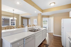 Condo, Multiple Beds, Patio (Sunkissed Cove) | Private kitchen - 2mm Main Channel Views, Boat & PWC Slip, 2 Pools, Playground & Tennis (Lake Ozark)