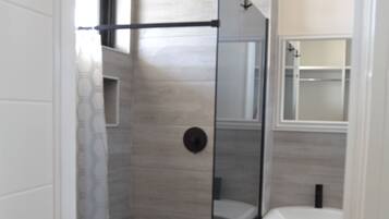 Shower, towels, soap, toilet paper