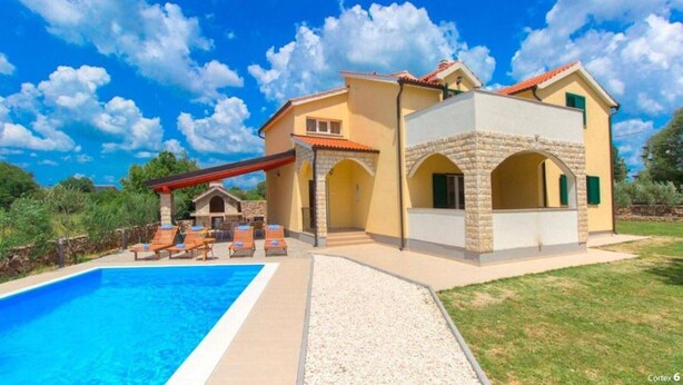 A two-story house with a swimming pool, outdoor seating, and a stone archway. - Villa Dalmacija (Drnis)