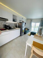 Condo, Balcony, Pool View | Private kitchen | Coffee/tea maker
