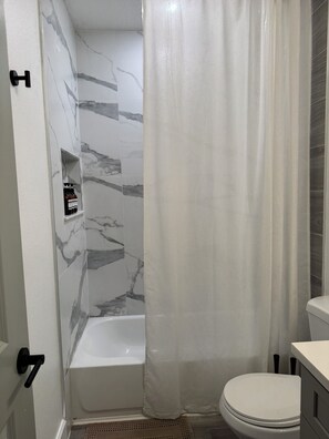 Shower, hair dryer, towels, soap