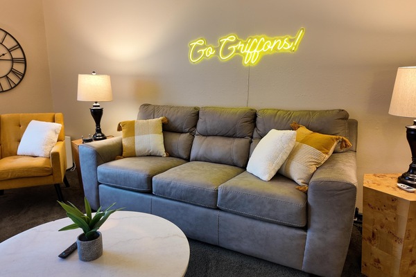 Cozy living room with stylish seating and warm lighting