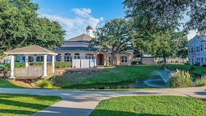 A residential property with a gazebo, a pond, and a well-maintained lawn. - Legacy Villa 2602 - 3 Bedroom 2 Bath With Garage in Beachside Neighborhood (Gulfport)