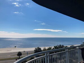 A balcony with a view of a beach and the ocean. - Spacious Beachview End Unit in Legacy Tower 1-501 - 3 Bedroom 3 Bath Condo (Gulfport)