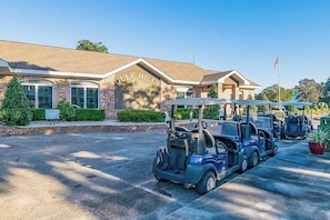 A golf club building with a sign reading "Gulf Hills Golf Club". - Brand New, Fully Furnished 3 Bedroom, 3 Bathroom Home in Ocean Springs! (Ocean Springs)