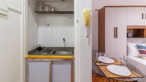 A compact kitchenette with a sink, a small countertop, and a telephone. - 5Min Da Praia De Copacabana | Br902 (Rio de Janeiro)