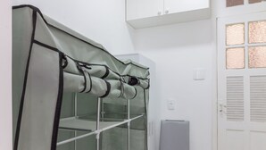 A room with a large window, a white door, and a white cabinet above the door. - 14 Minutos Da Praia De Copacabana | Fo801 (Rio de Janeiro)