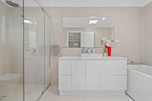 Shower, hair dryer, towels, soap