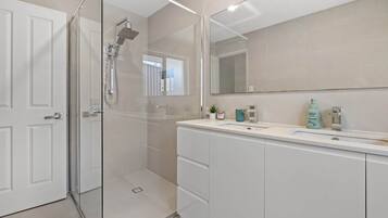 Shower, hair dryer, towels, soap
