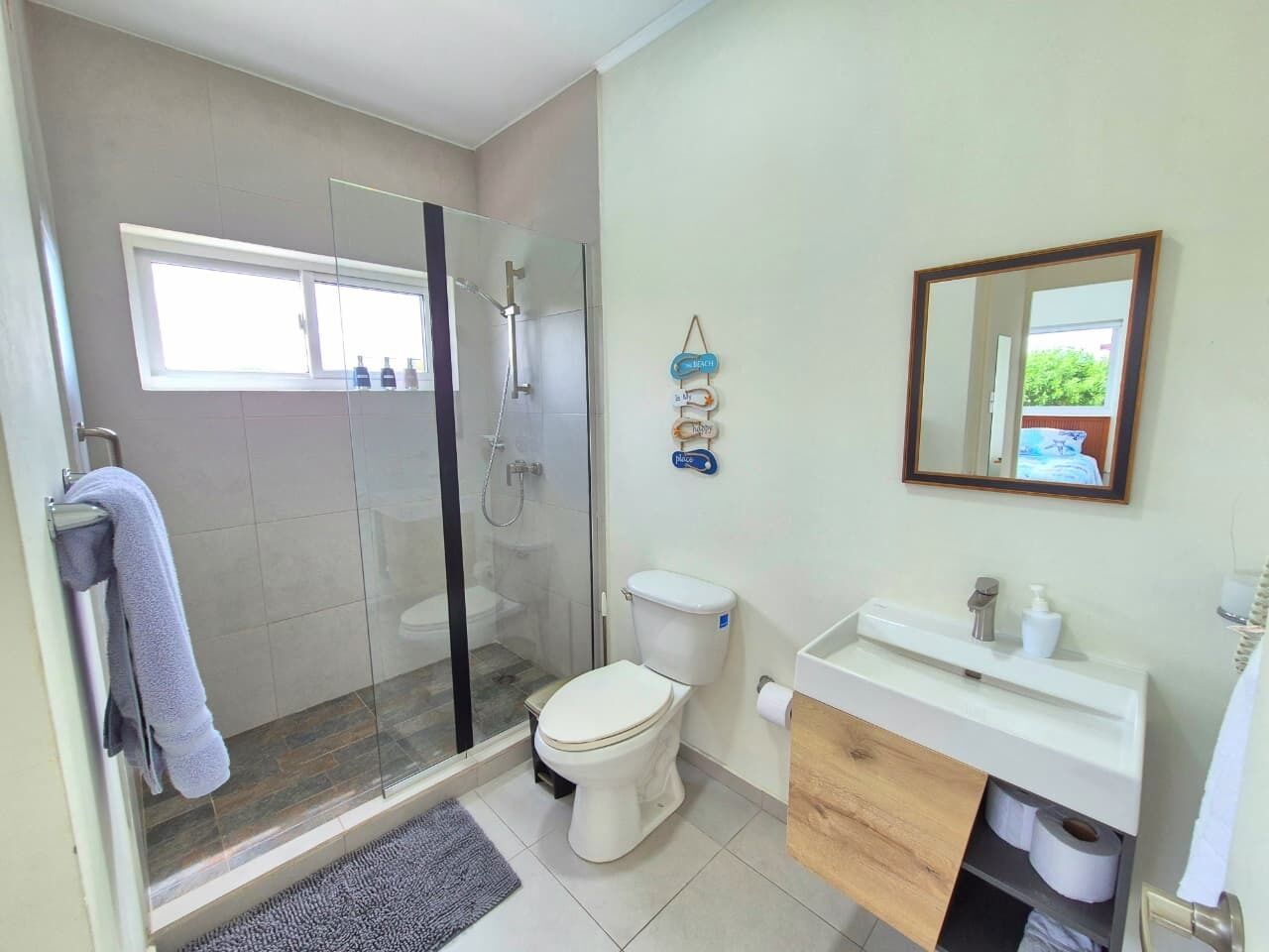 Shower, hair dryer, towels, shampoo