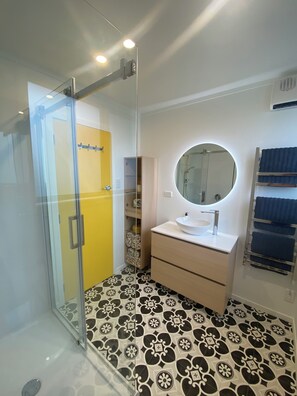 Shower, hair dryer, towels, soap